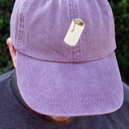 Image of front of purple dad hat with embroidered burrito