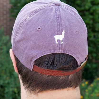Image of back of purple hat with embroidered llama