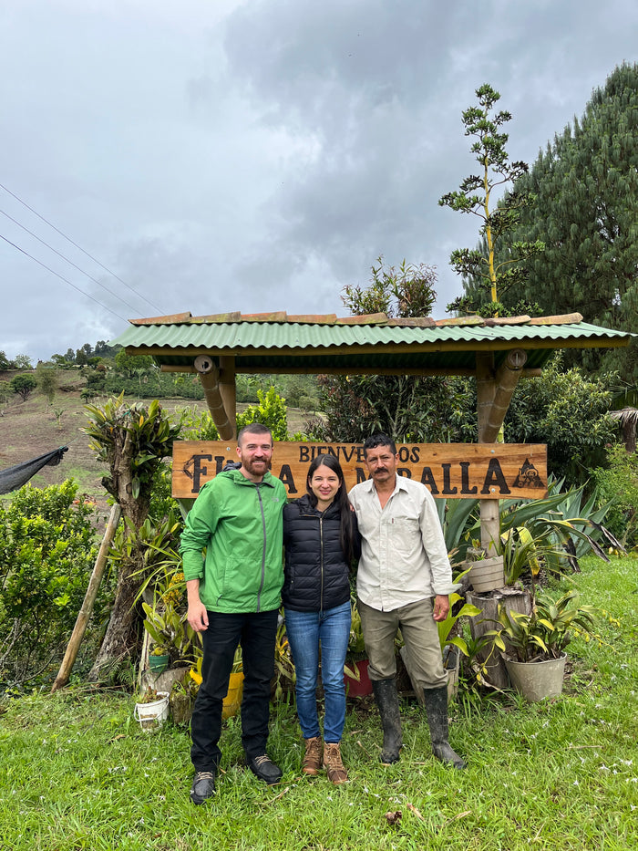 Image of three people in Huila, Colombia with the Coffee Quest