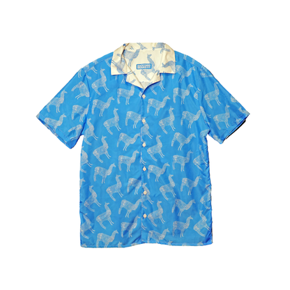 Blue shirt with white llama pattern on a white background