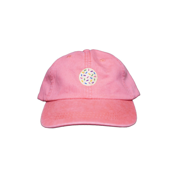Image of coral dad hat with embroidered sprinkle cookie